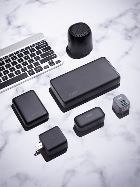 Tech traveler with smartphone and small gadgets, illustrating Best Budget Gadgets for Tech Travelers: Must‑Have Chargers, Trackers, and Privacy Tips