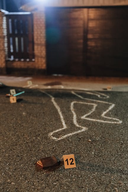 Laptop on desk at night showing network traffic activity during a suspicious upload