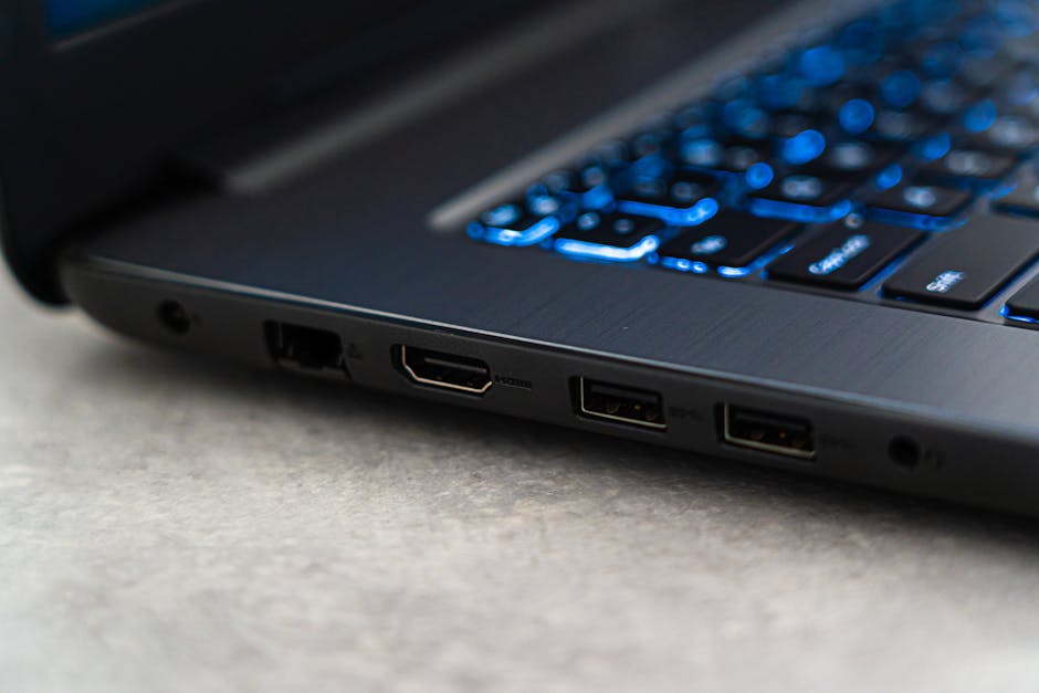 Close-up of a laptop&rsquo;s side USB-C ports and icons for checking video support