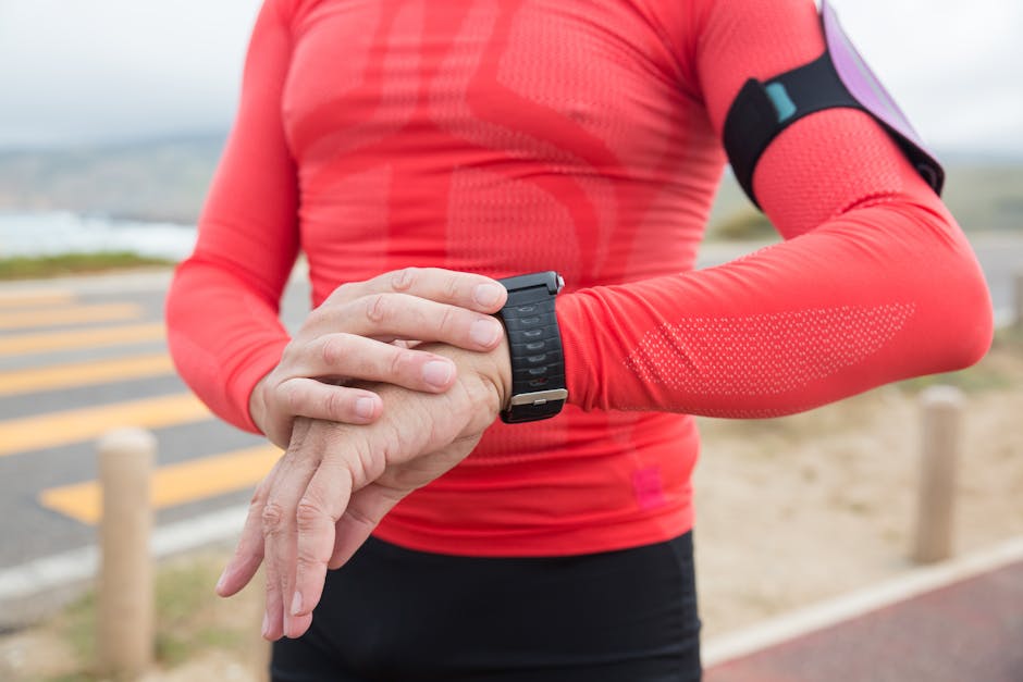 Runner checking GPS on a smartwatch during a workout