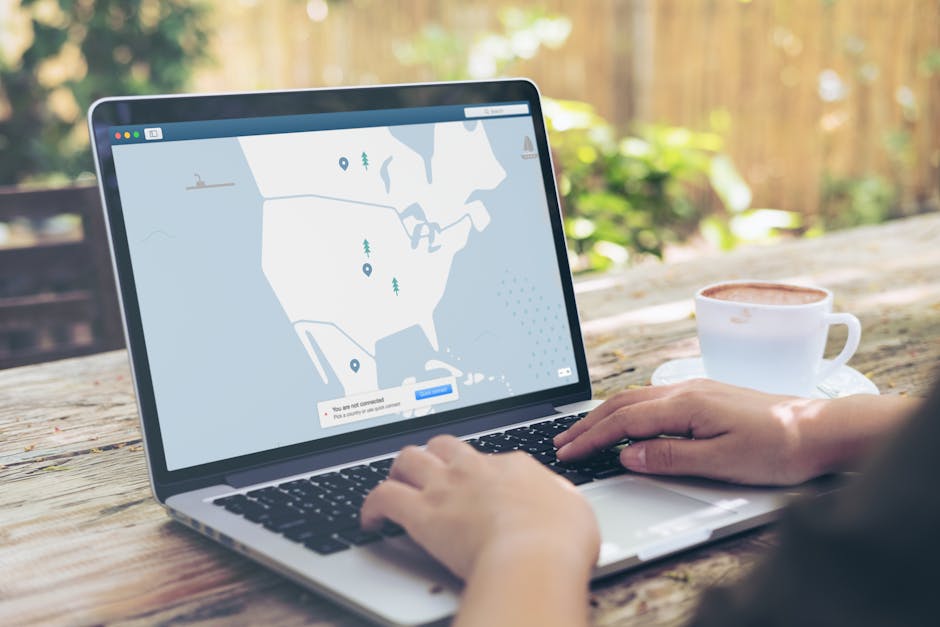Traveler using a VPN on a laptop at a cafe to stay safe on public Wi-Fi