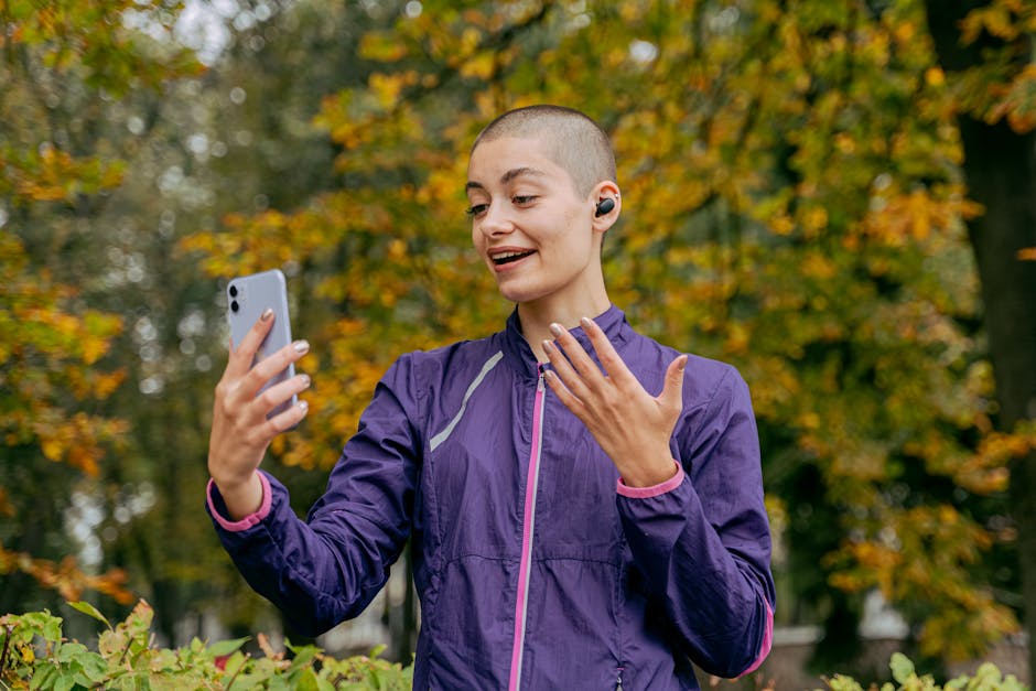 Person wearing wireless earbuds during a phone call to show mic clarity testing