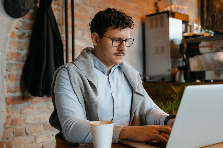Remote worker using a laptop in a cafe with an untrusted Wi‑Fi connection