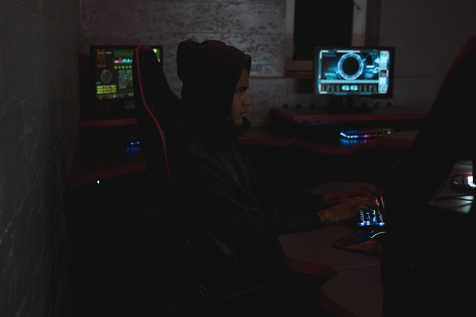 Cybersecurity analyst watching alert dashboards in a operations control room