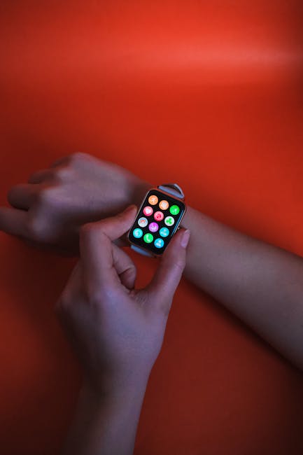 Close-up of a smartwatch glowing with notifications and sensors running