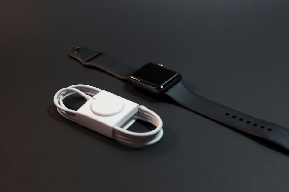 Smartwatch charging at night on a bedside table