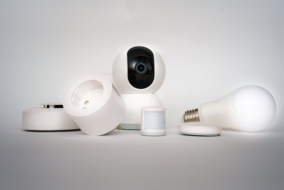 Person setting up smart home hub and devices on a living room table