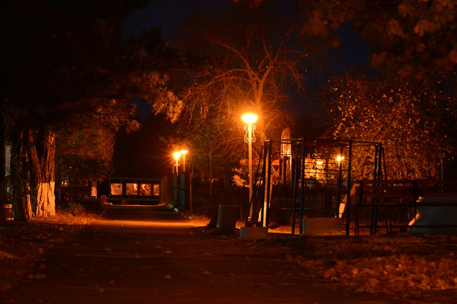 Smartphone taking a photo of street lights at night for low-light testing