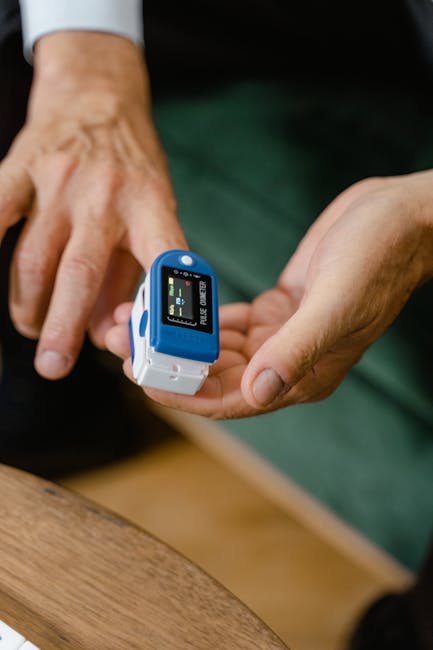 Person seated calmly comparing smartwatch SpO2 with a fingertip pulse oximeter