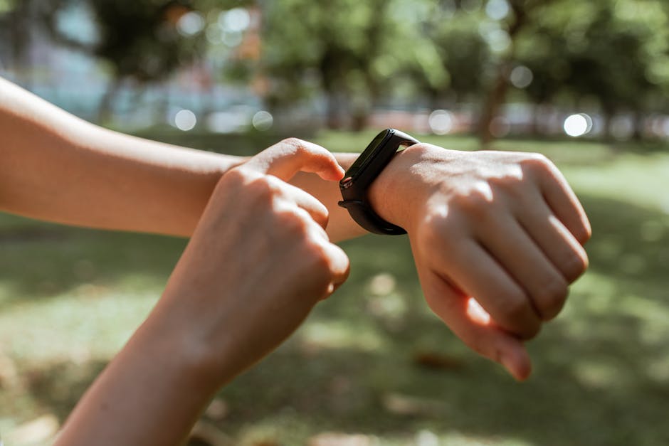 Smartphone displaying smartwatch vs fitness tracker comparison, illustrating smart health data and goals