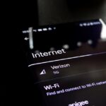 Wi‑Fi 7 Explained: router and smartphone showing faster speeds and lower latency in real‑world performance