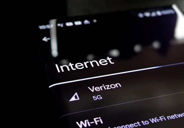 Wi‑Fi 7 Explained: router and smartphone showing faster speeds and lower latency in real‑world performance