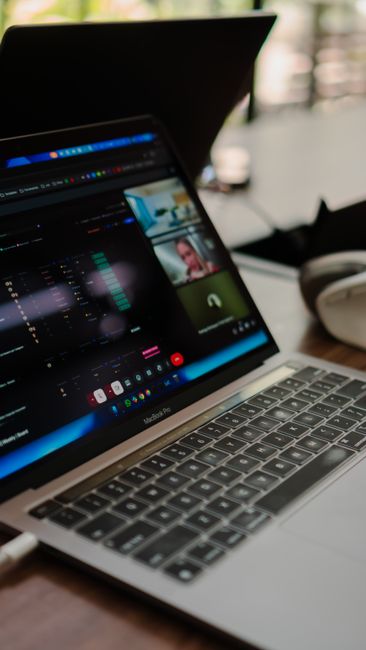 Person viewing a virtual machine interface on a laptop for isolated cybersecurity practice