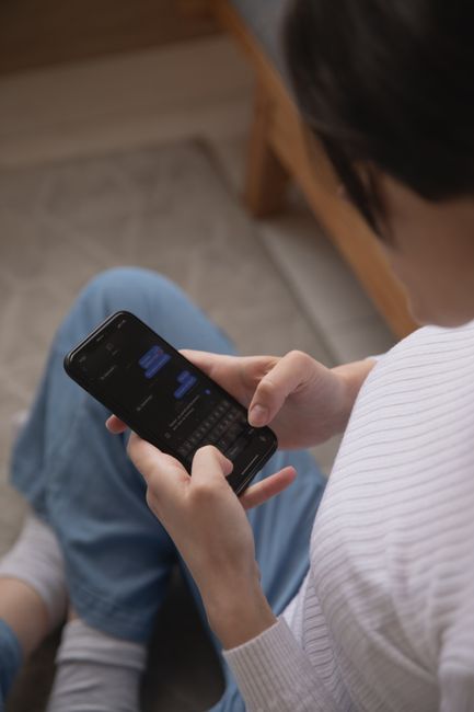 Person reviewing Android security update and software version settings on a smartphone