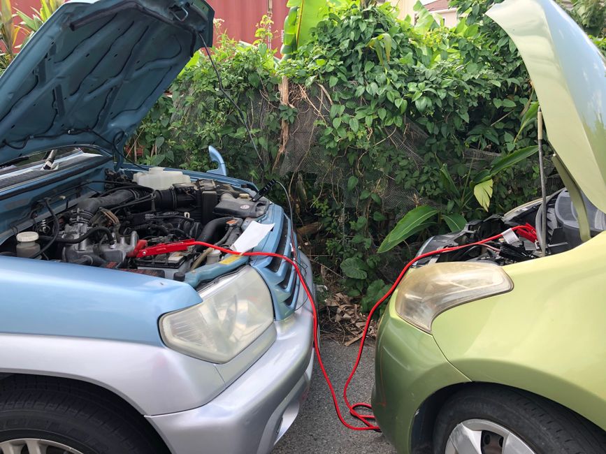 Portable power station being charged safely in a vehicle with cables connected away from heat