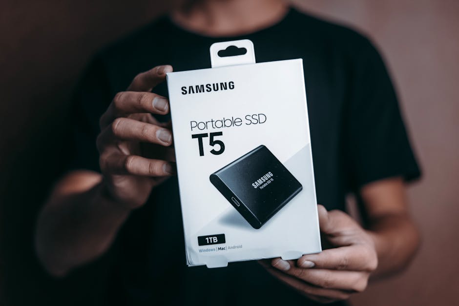 Rugged portable SSD in a padded travel pouch with visible USB-C connection