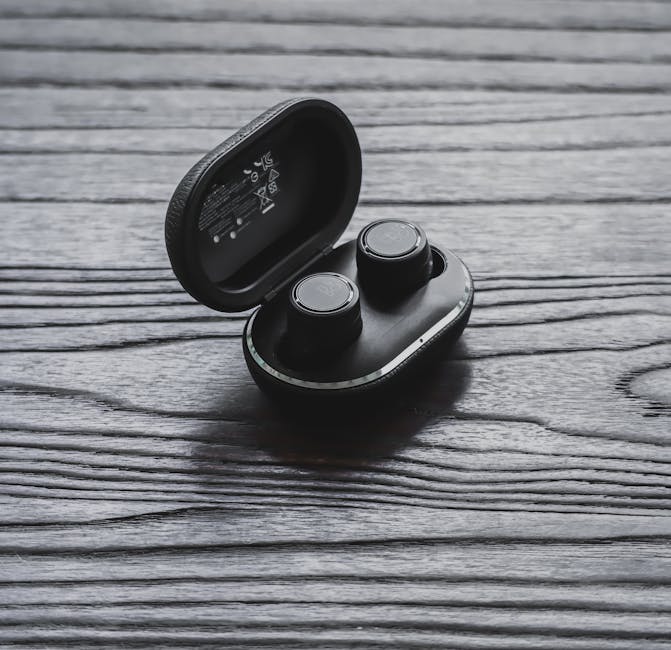 Person listening with wireless earbuds while moving around a room to test signal range
